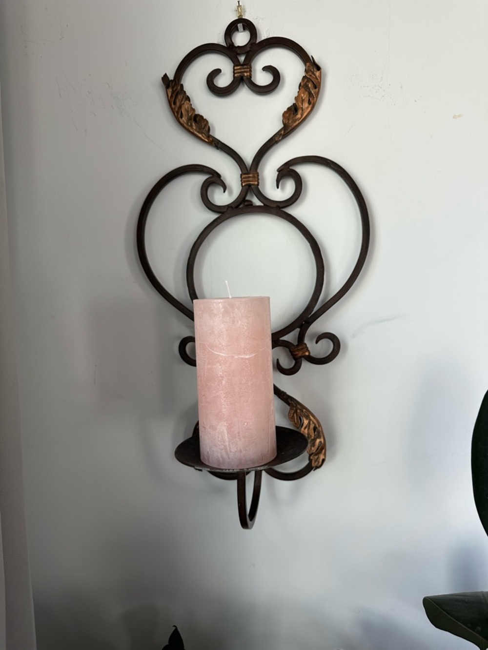 Wall-Mounted Metal Sconce candle holder with pink candle